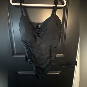 Very cute, flattering swim suit from torrid. It is a size 1/XL.